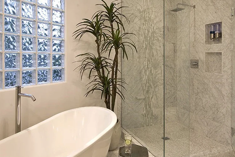 White bathroom featuring a modern glass shower enclosure